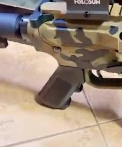 A firearm fitted with a Holosun red dot optic
