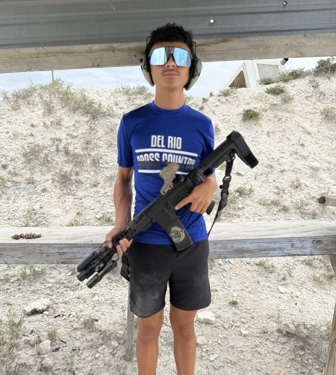 A young Del Rio shooter in eye and ear protection at the range